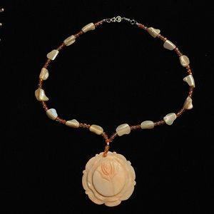 Beautiful hand made shell and beaded necklace with Flower pendant
